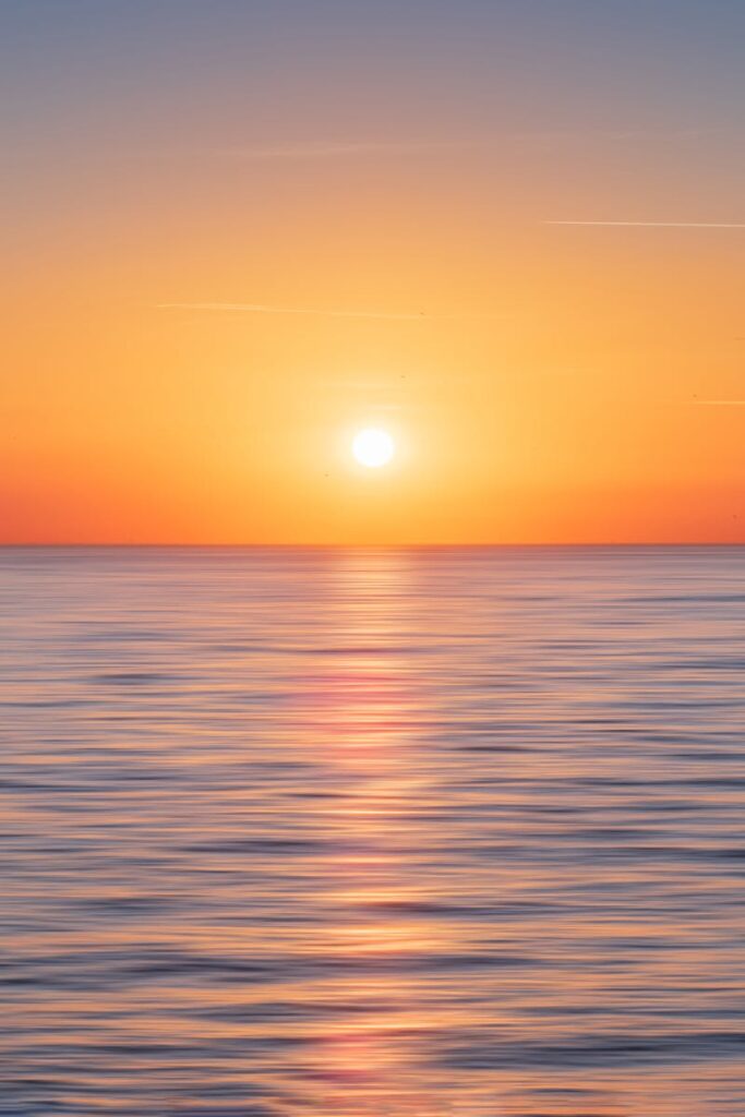 Serene ocean view during sunset in Kadıköy, Istanbul, showcasing a beautiful horizon and calm waters.